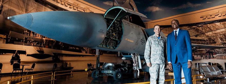 photograph of Atlanta Fed President and CEO Raphael Bostic standing together with a large group of high school students