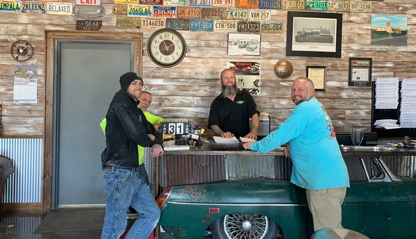 Owner Bobby Holland employs eight people at his auto body shop in Robertsdale, Alabama. His shop is decorated with some vintage touches. Photo courtesy of United Bank