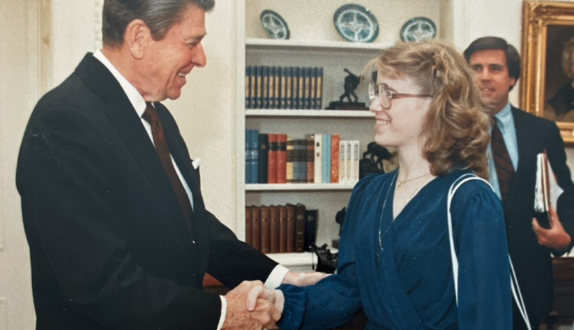 President Reagan shakes Leslie's hand after the award ceremony.