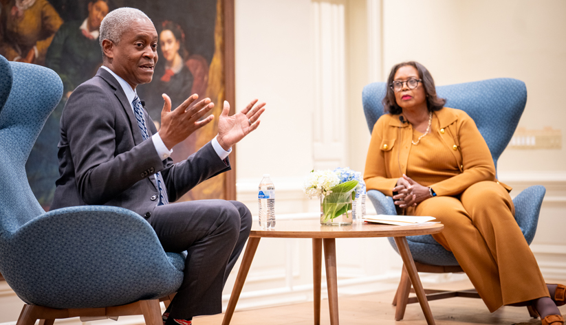 Atlanta Fed president Raphael Bostic onstage with Juliette Pryor, chair of the board of trustees of Fisk University