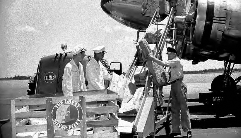 Loading baggage onto a plane in 1944 at Atlanta Municipal Airport. Photo courtesy the Special Collections and Archives, Georgia State University Library