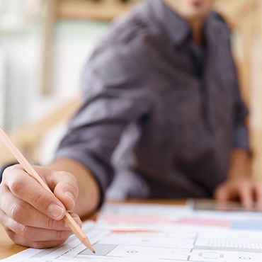 a man with his hand writing