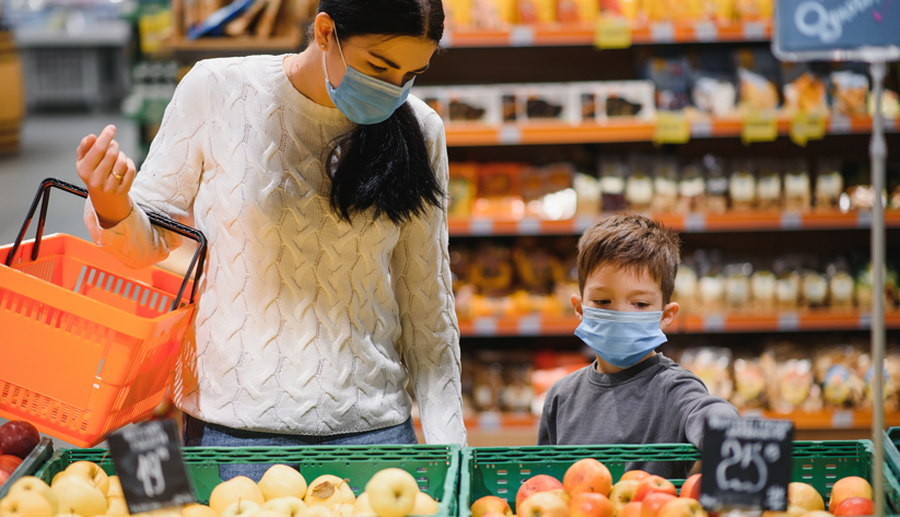 mom and son at grocery store
