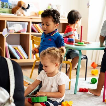 three kids playing at daycare