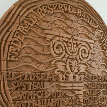 Embossed clay Atlanta Fed seal with the Atlanta Fed column and Federal Reserve mission statement. Embossed Atlanta Fed clay seal with column and mission statement