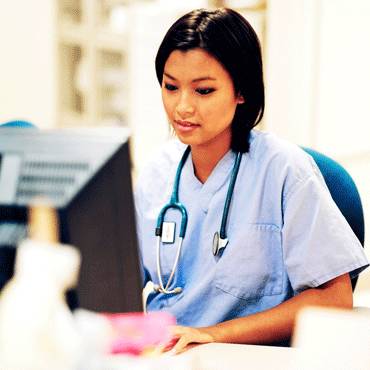 female doctor at a computer