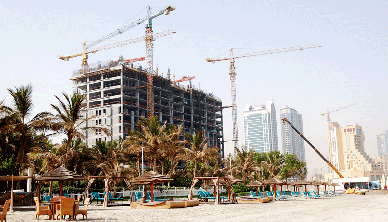 image of highrise under construction on a beach in a tropical setting