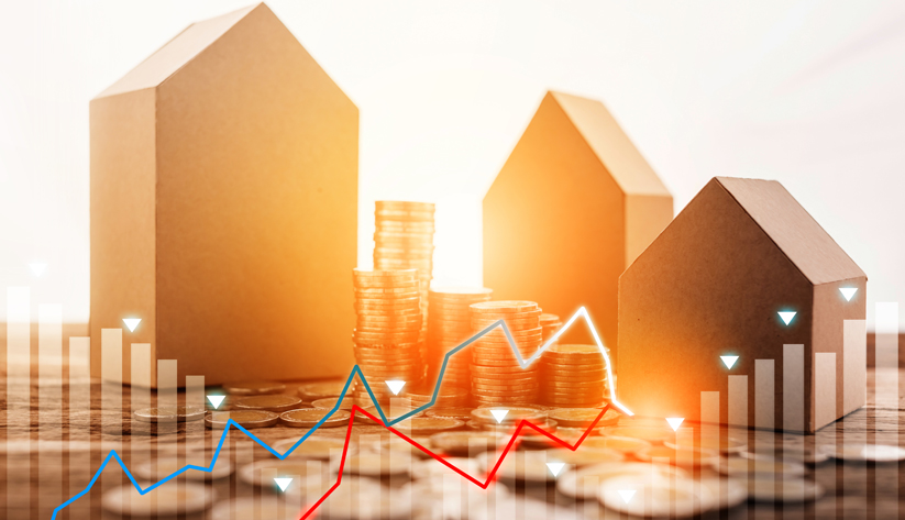 Houses backlit by sunlight with coins in foreground with graph lines superimposed over image
