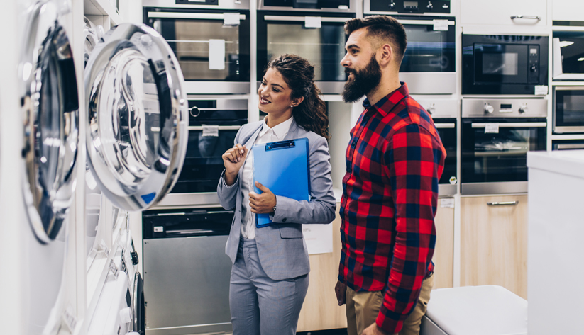 couple shops for washing machine and dryer