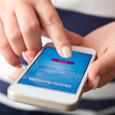 hands holding and operating a smart phone