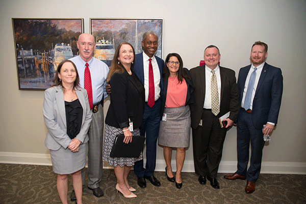 Photo of Raphael Bostic with attendees of forum in Jacksonville, Florida