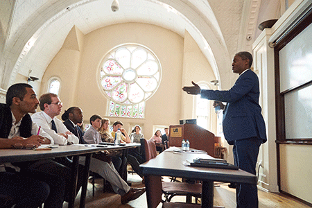 Photo of Raphael Bostic speaking to students