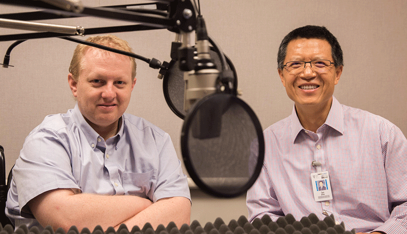 Pat Higgins, associate policy adviser and economist, and Tao Zha, research center executive director, at the recording of a podcast episode.