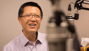 Tao Zha, research center executive director, at the recording of a podcast episode.