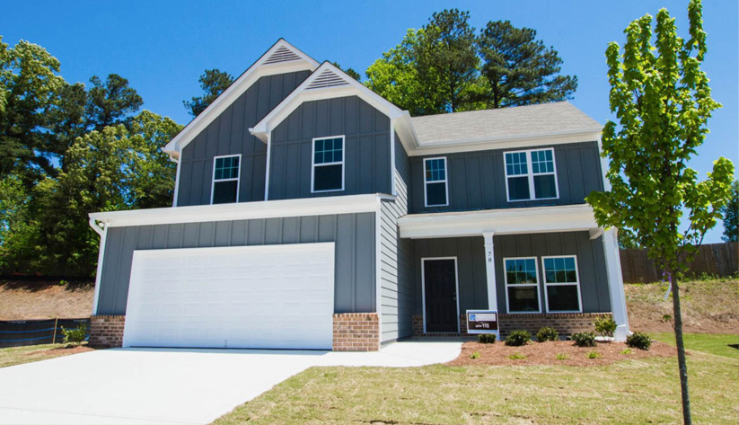 photo of two-story house with a front lawn