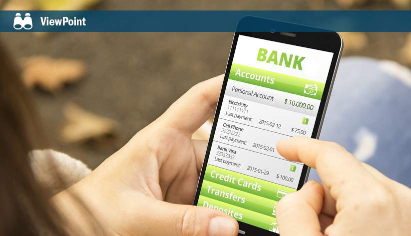 Hand holding smartphone displaying mobile banking app with account balances and recent payment history