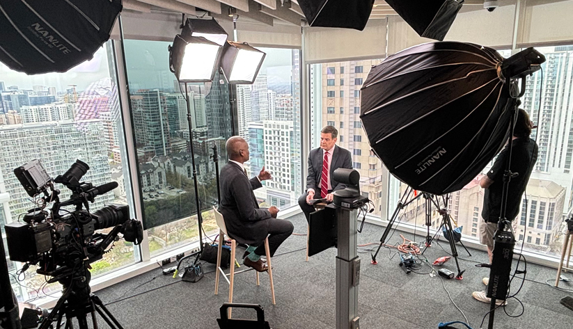  Raphael Bostic (left) with journalist Michael McKee in the Bloomberg studio in Atlanta.