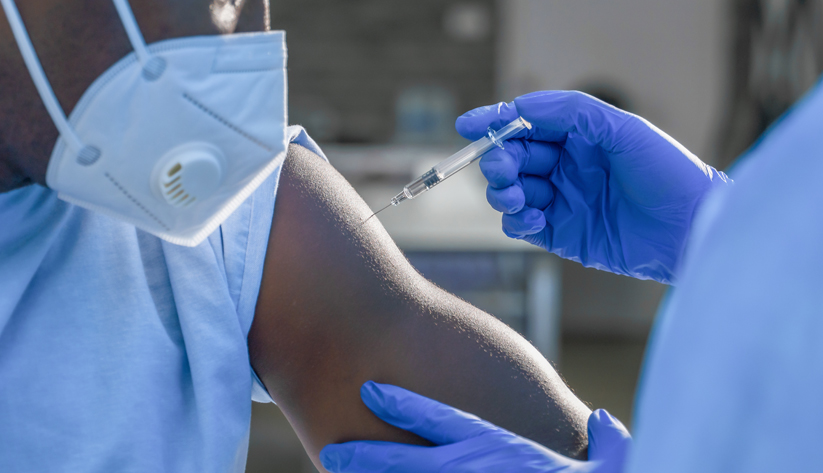 Needle about to inject medication in to arm