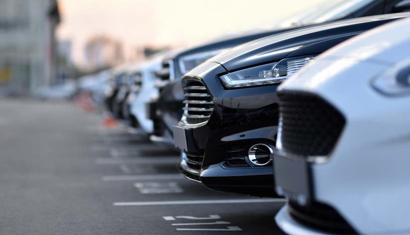 rows of cars in parking lot