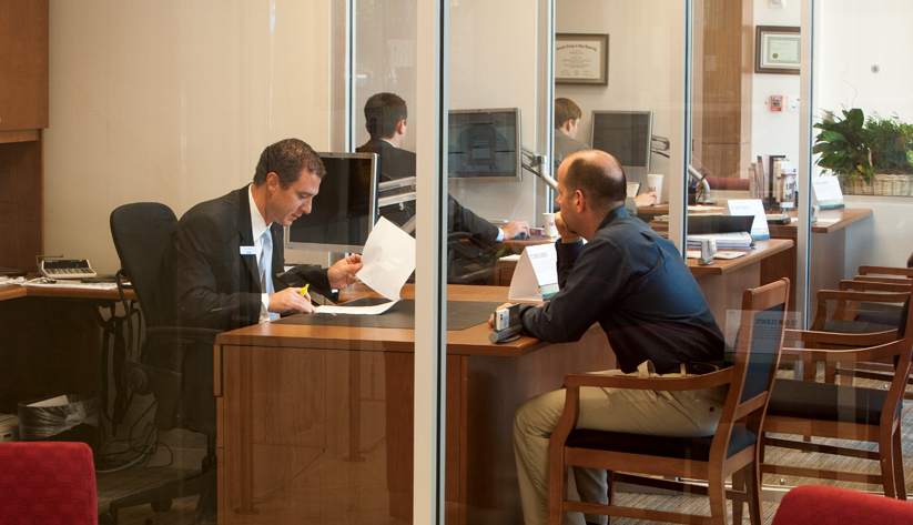 bank teller helping customer