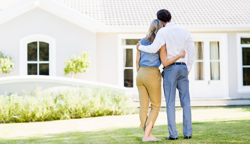 family of two looking at a home