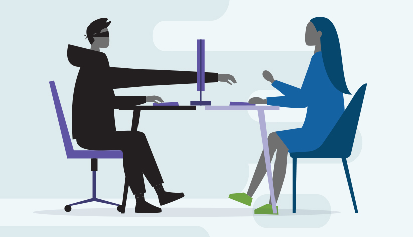 two people sitting at table separated by screen with one person reaching through to other side