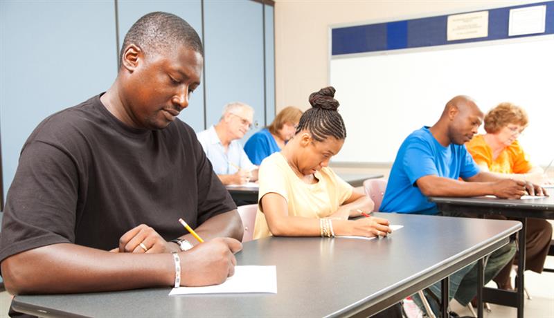 people testing in a classroom