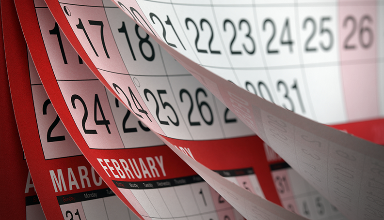 calendar with pages blowing through several months