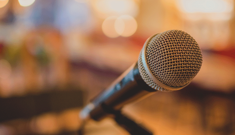 microphone with blurred audience background
