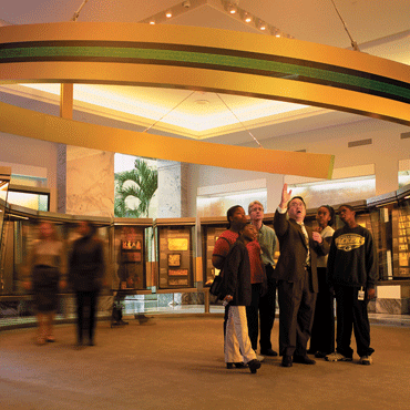 Atlanta Fed monetary museum tour group and guide at ring case