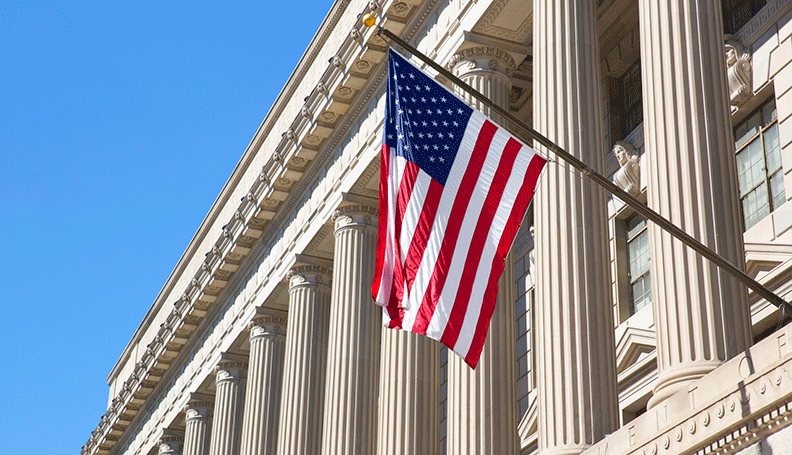 federal reserve board building facade with flag
