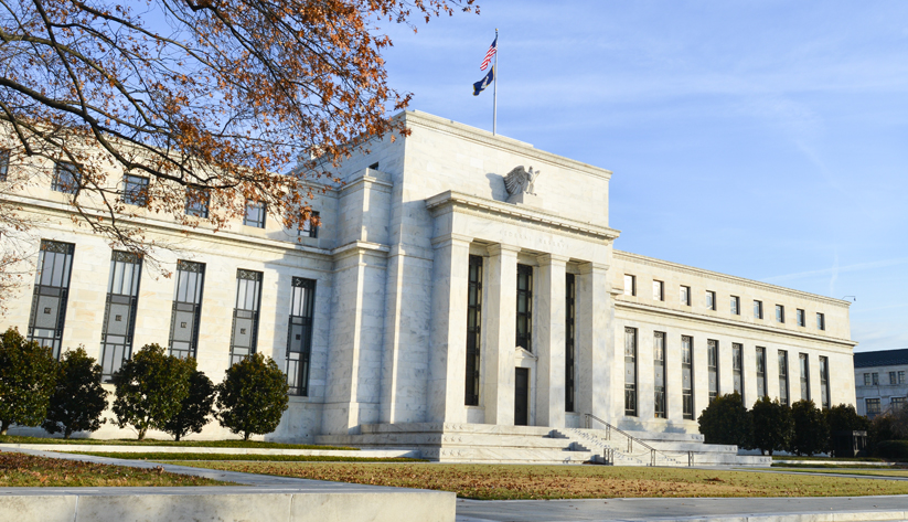 federal reserve board building exterior photographed at an angle from the left on a bright day