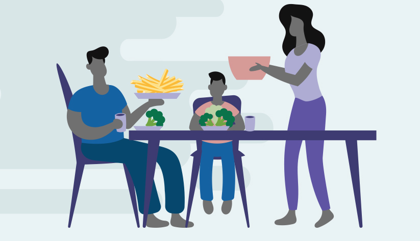 family sitting of three sitting at dinner table