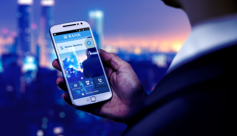 hand holding mobile phone with mobile banking on the screen