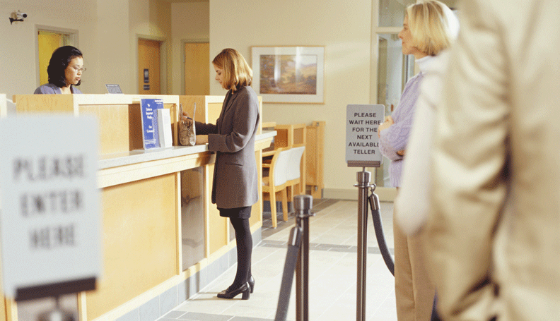 woman inside the bank at the counter