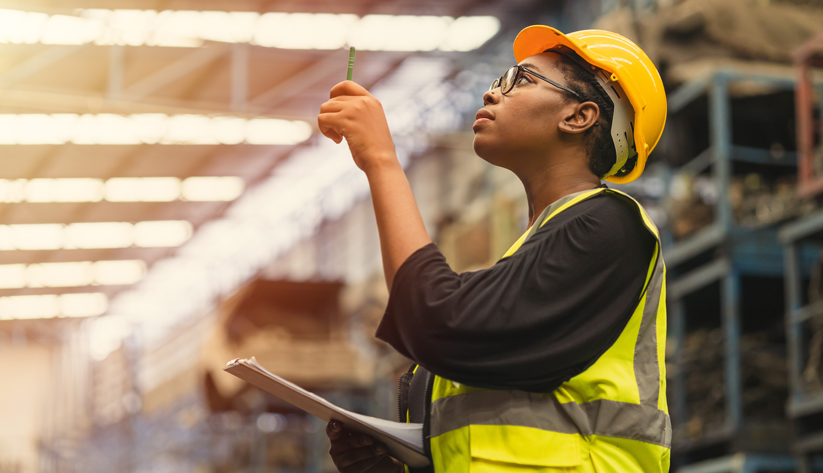 female construction worker with clipboard