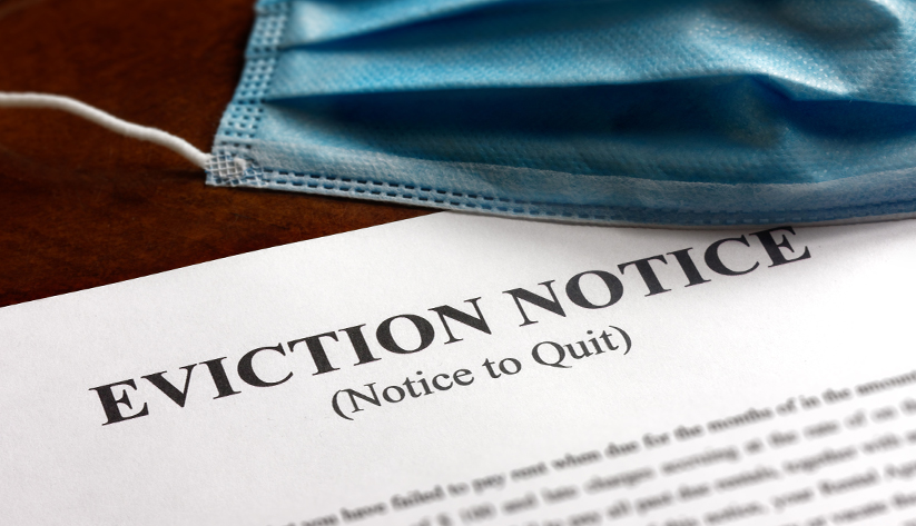 eviction notice with face mask laying on top