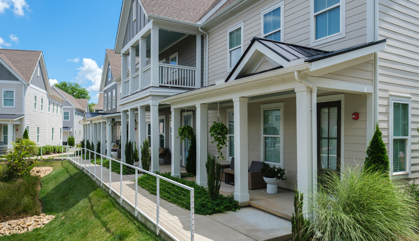 Row of attached single family homes with porches