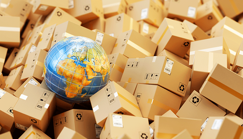 globe on top of pile of cardboard boxes