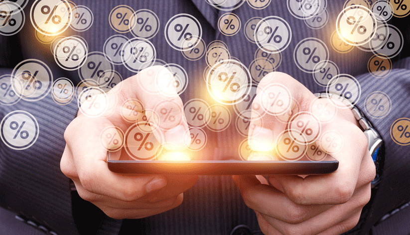 hands holding a tablet with percent signs floating out