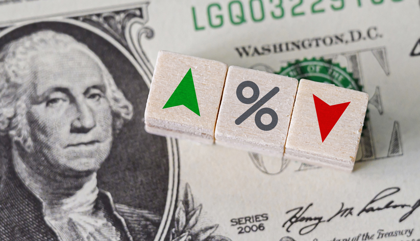 close up of interest dice on a dollar bill