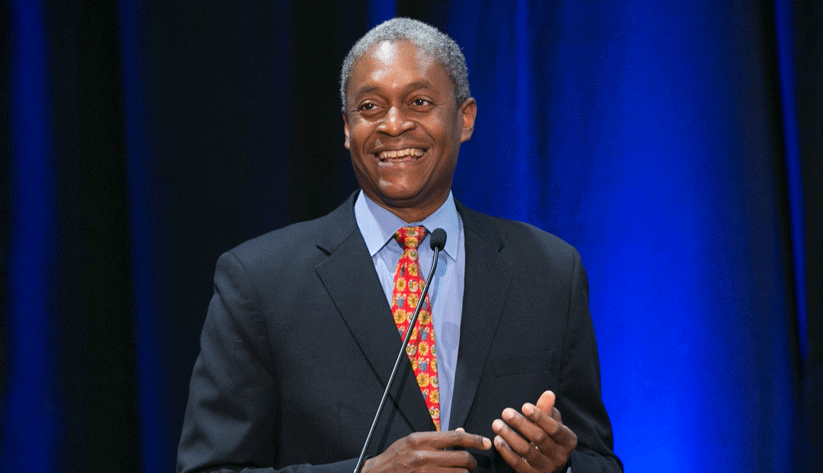 Photo of Raphael Bostic speaking at a podium