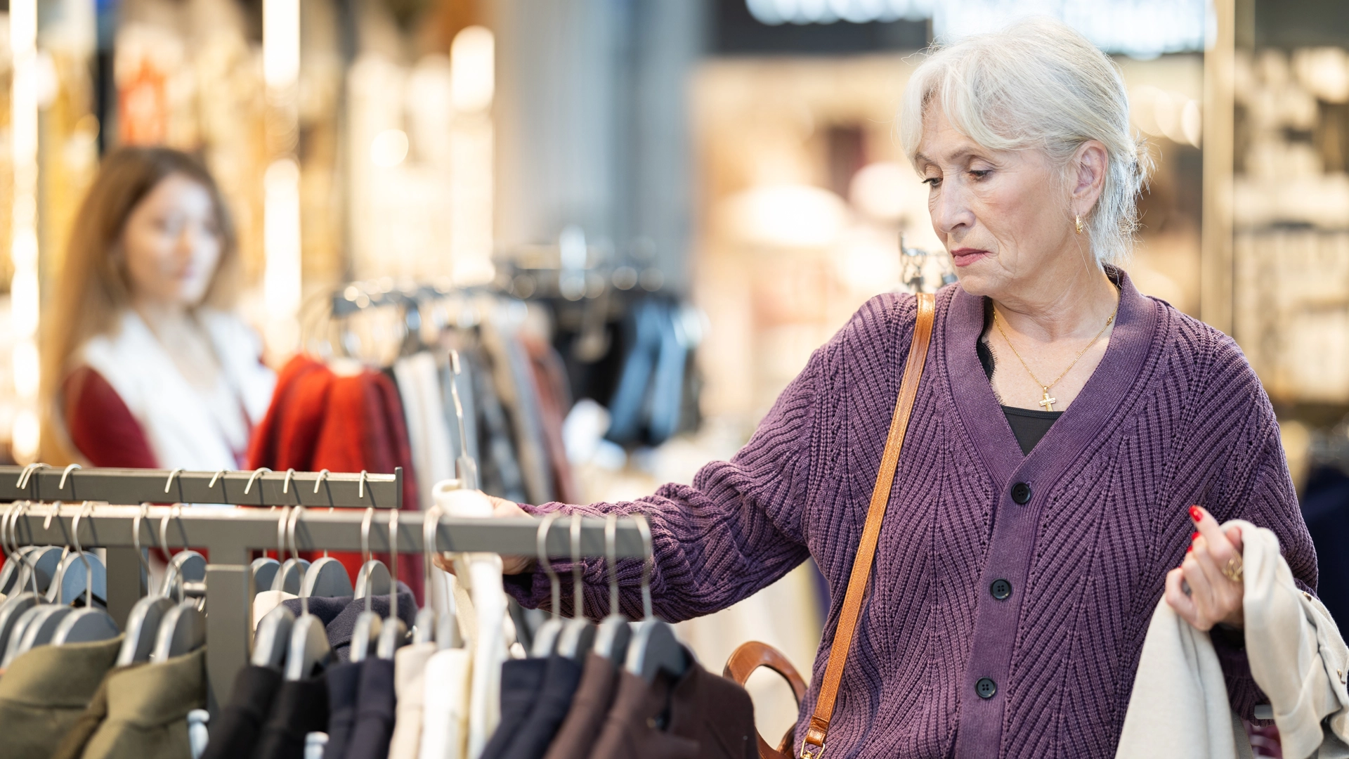 Older woman shopping in a clothing store
