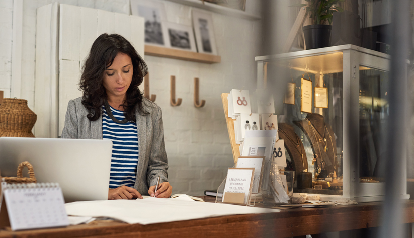 a woman sitting at her desk working