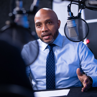 Photo of Domonic Purviance during the recording of the podcast episode. Photo by Stephen Nowland.