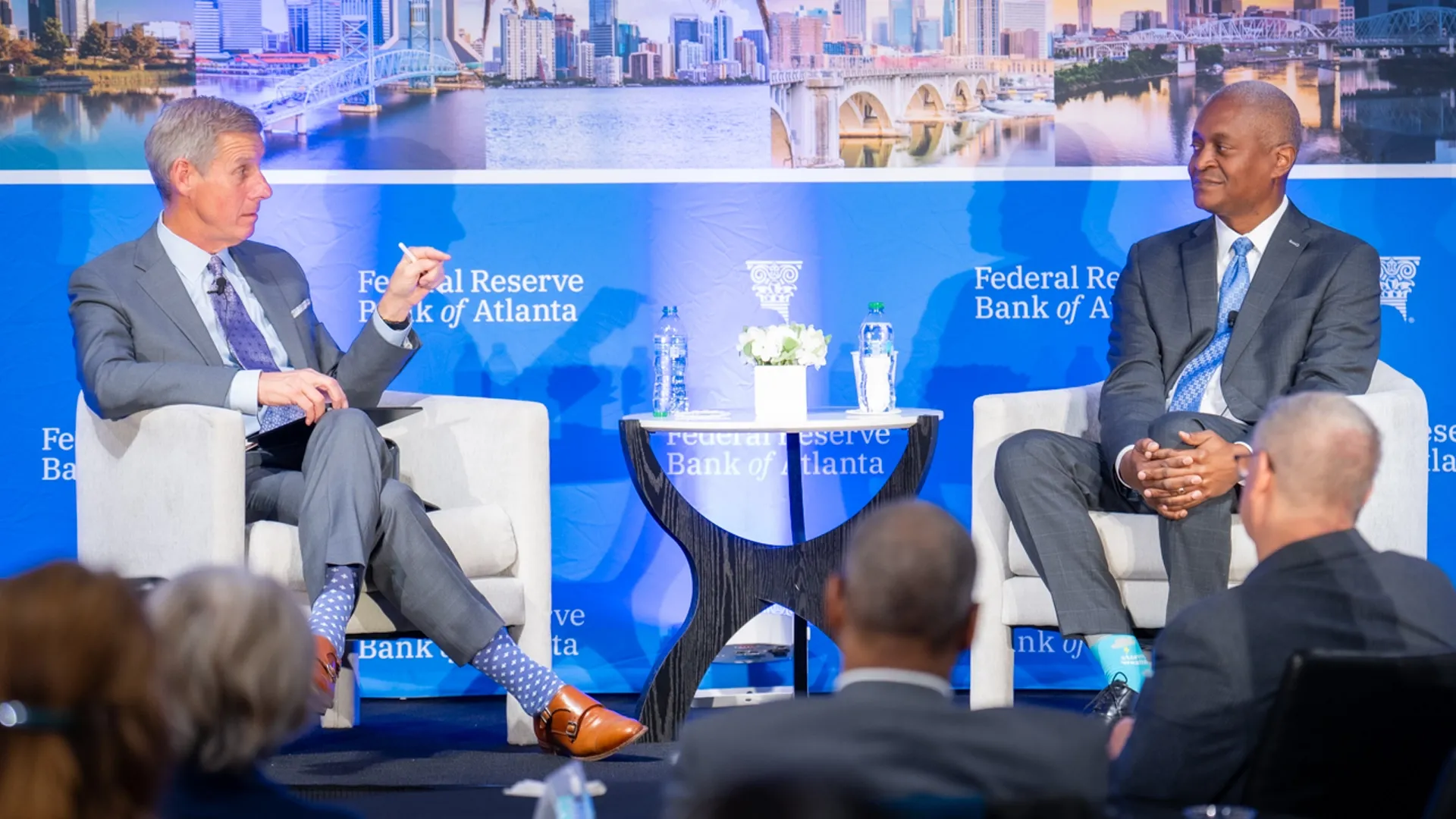 Kai Ryssdal of Marketplace on left interviewing Raphael Bostic