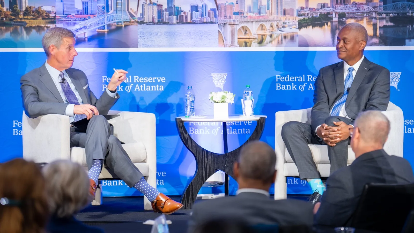 Kai Ryssdal of Marketplace on left interviewing Raphael Bostic