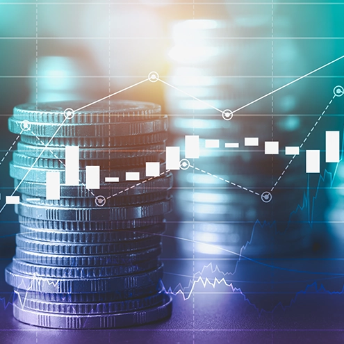 coins stacked while also displaying a data table and line graph