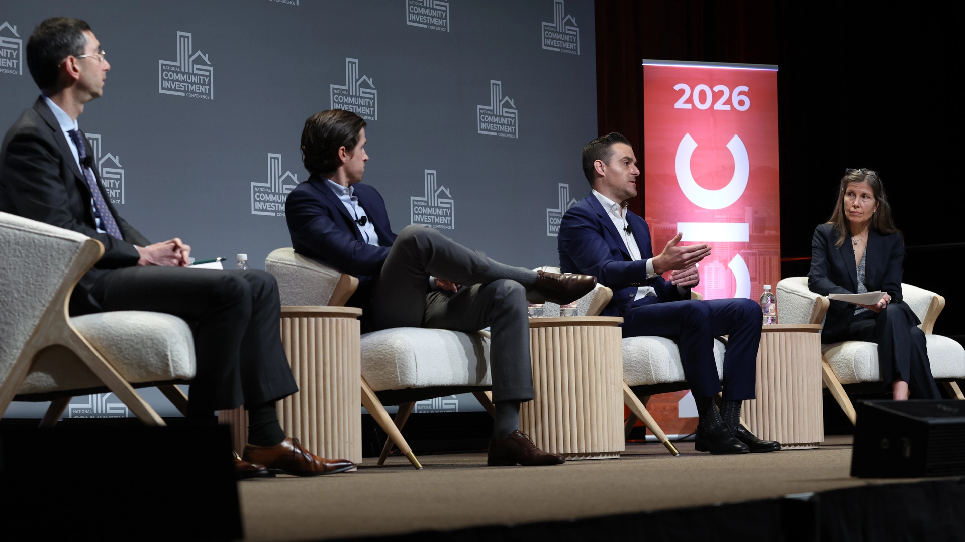 Atlanta Fed vice president Karen Leone de Nie (at right) moderates a discussion at the National Community Investment Conference