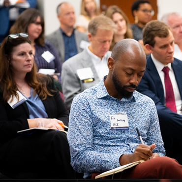 Conference attendees attend a breakout session